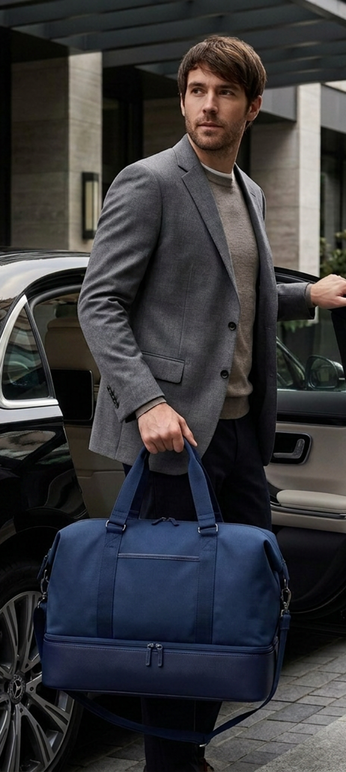 Model carrying the navy Weekender bag